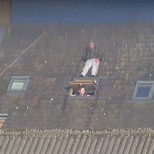 Man tries to avoid police officer by hiding on velux window